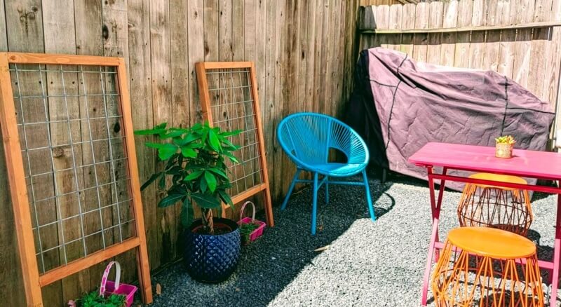 A small backyard, but accented with plants and pops of color.