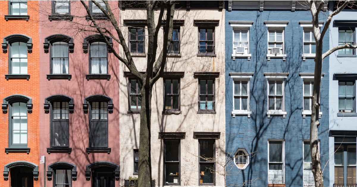 photograph of orange, white and blue condos and apartment buildings